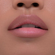 I Need a Nude Lip Crayon shade 'Nina' model look.