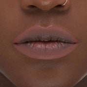 I Need a Nude Lip Crayon shade 'Nina' model look.